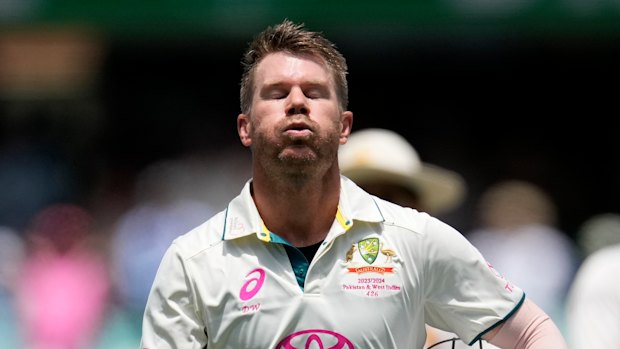 Australia’s David Warner walks off the field after he lost his wicket to Pakistan on the fourth day of their cricket test match in Sydney, Saturday, Jan. 6, 2024. (AP Photo/Rick Rycroft)