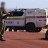 Police, including tactical response group officers, are searching for Kenneth Giles, who is accused of shooting a woman in Mullewa. Picture: 9News Perth