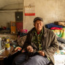 Liu lives in a crumbling village. Nearby a compound of luxury villas remain untouched