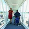 Shane Hryhorec boarding a flight to Japan. Travelling in a wheelchair is totally possible… but the travel industry just needs to get on board.