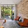 The open-plan living room and courtyard at 34 Flora Street.