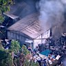 A blaze rips through sheds in a Mango Hill backyard on December 28, 2025.