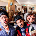 Composite image of comedy trio Sooshi Mango and the interior of their Carlton restaurant Johnny Vince & Sam’s.