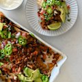 Loaded double-bean nachos with fresh pico de gallo.