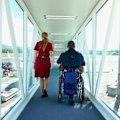 Shane Hryhorec boarding a flight to Japan. Travelling in a wheelchair is totally possible… but the travel industry just needs to get on board.