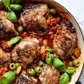 One-pan Mediterranean chicken with red capsicum and olives.