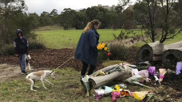 Annette Graham, 48, and 11-year-old son Coulton brought a bouquet of yellow roses to Royal Park to pay tribute to Courtney Herron on Monday morning.