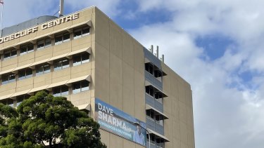 Wentworth MP Dave Sharma’s billboard on the side of the Edgecliff Centre. Woollahra Council has ordered the building owner to remove it because no advertising is permitted on the building.