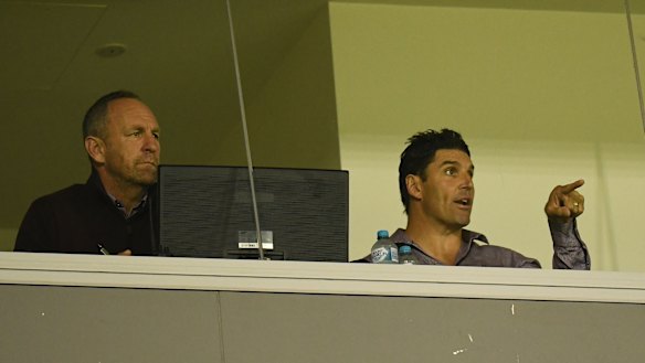 Pointing fingers: Trent Barrett and assistant coach John Cartwright during Manly's loss to the Tigers.
