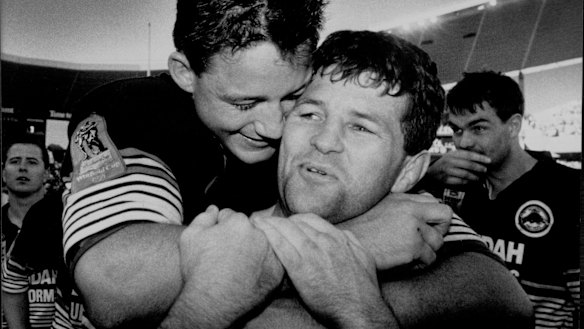 Mark Geyer hugs Royce Simmons.