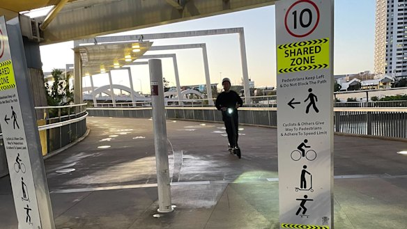 A private e-scooter owner using a touch more discernment to exit Kurilpa Bridge. 