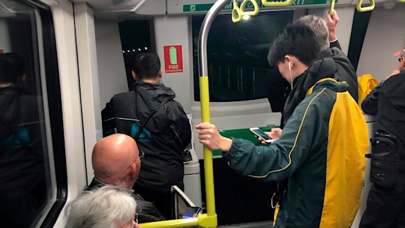 Driving a driverless train: A customer journey co-ordinator, left, took control of the train and drove it to Cherrybrook.
