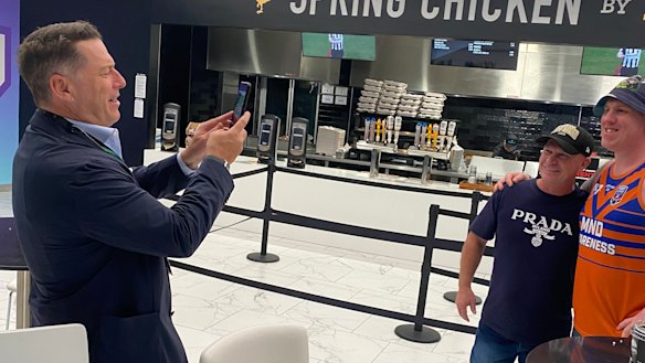 Karl Stefanovic takes a picture for a fan with Allan Langer in Las Vegas.