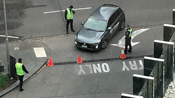 Guards and police at the entry of Crown Promenade hotel late in June. 