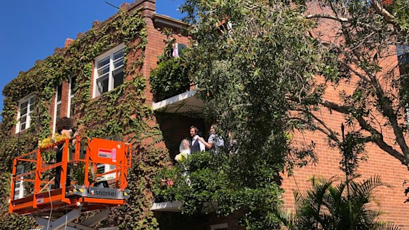 A couple creatively used a scissor lift to circumnavigate the government's strict wedding laws. 