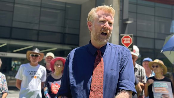Environmental activist Ben Pennings speaking outside the Supreme Court in Brisbane on Thursday.