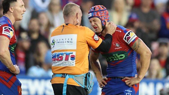 Kalyn Ponga receives treatment for his shoulder injury.