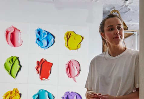Cj Hendry in front of her hand-drawn work in Brooklyn, New York. 