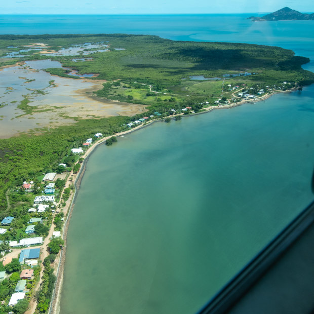 Flying into Saibai Island. Its $24 million sea wall was breached less than six months after its completion. During storm surges, the sea sluices under homes.