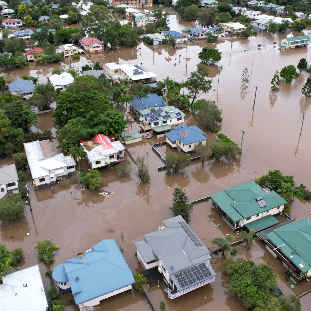 Houses in Lismore, northern NSW, surrounded by flood water in March.