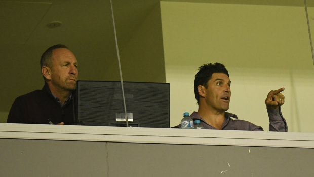 Pointing fingers: Trent Barrett and assistant coach John Cartwright during Manly's loss to the Tigers.