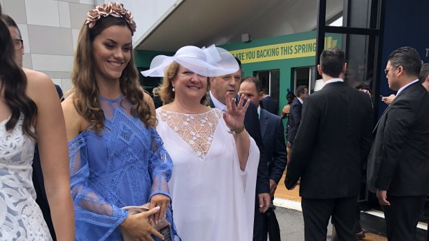 Gina Rinehart gives the royal wave inside the Birdcage at this year's Melbourne Cup.
