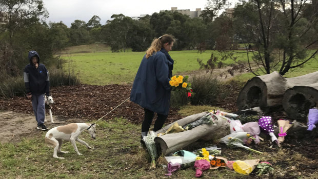 Annette Graham, 48, and 11-year-old son Coulton brought a bouquet of yellow roses to Royal Park to pay tribute to Courtney Herron on Monday morning.