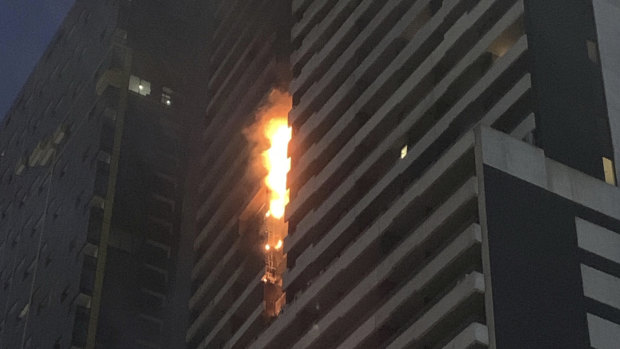 The Neo 200 apartment building in central Melbourne caught fire in February. Residents have been struggling to renew their insurance. 
