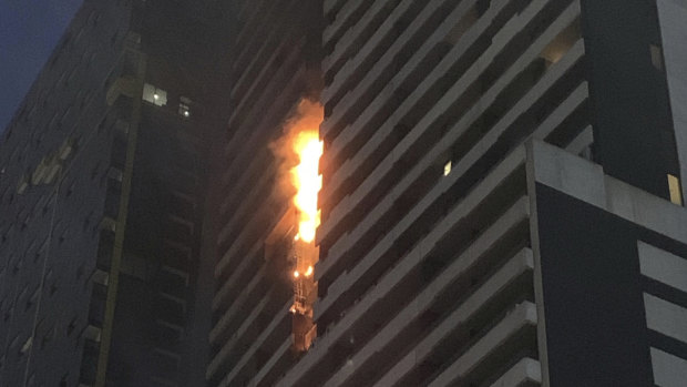 Fire spreads through combustible cladding at the Neo200 building on Spencer Street.