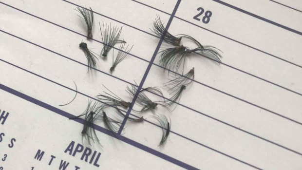 Fake lashes strewn on a school diary, which students at Mater Christi College in Belgrave were forced to remove. 