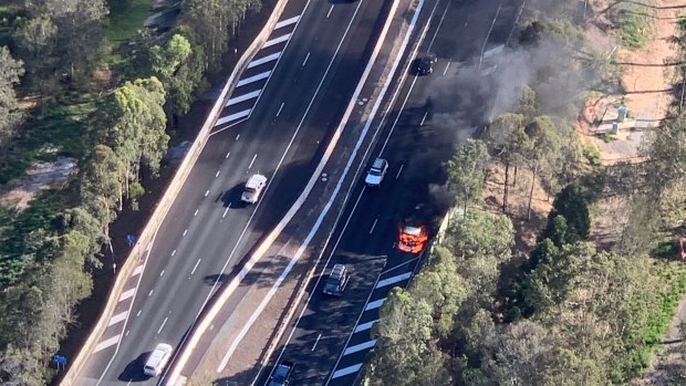 A burning truck has closed lanes and caused delays on the Gateway Motorway at Eight Mile Plains.