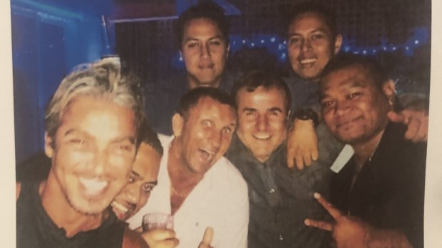 John Ibrahim (left) partying with former strip club manager Michael Amante (white shirt). 