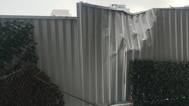 Photos of a fence at the rear of the apartment complex in Zetland.