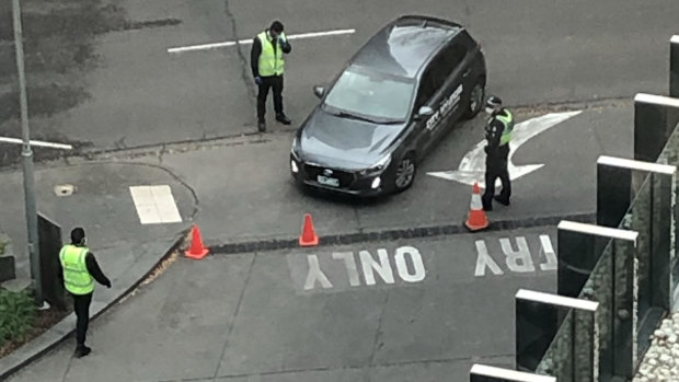 Guards and police at the entry of Crown Promenade hotel late in June. 