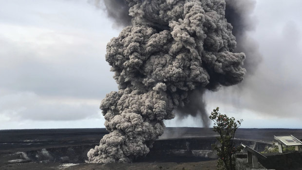 An ash column rises from the crater at the summit of Kilauea volcano on Wednesday.