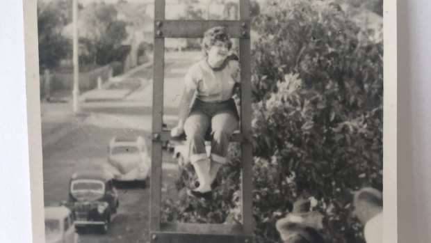 Jane Petersen's mother Joy Petersen gets a viewing spot on a train tower during the Queen's tour in 1954. 