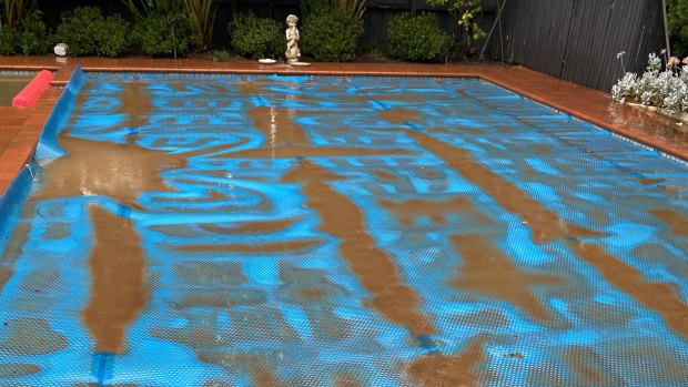 A pool blanket shows the stark effect of the red dust. 