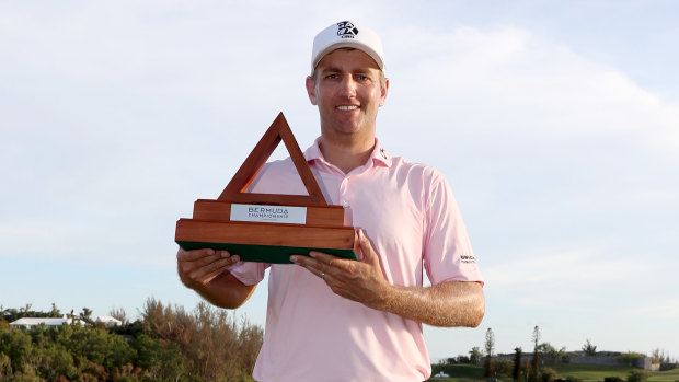 Brendon Todd celebrates with the Bermuda Championship trophy.