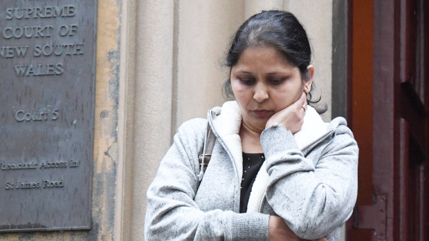 Seema Chaudhary leaves court after giving evidence.