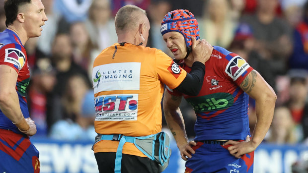 Kalyn Ponga receives treatment for his shoulder injury.