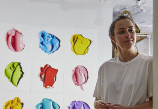 Cj Hendry in front of her hand-drawn work in Brooklyn, New York. 