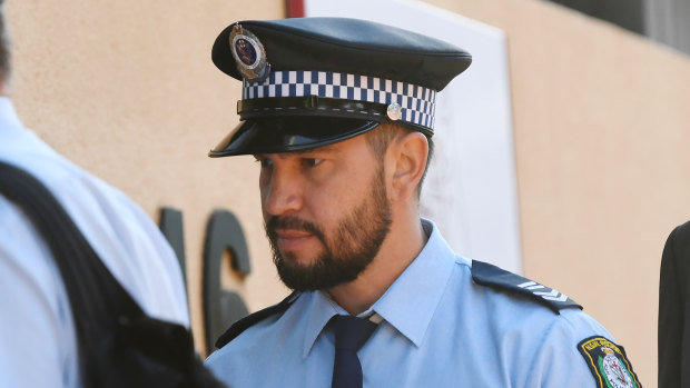 Senior Constable Ethan Tesoriero arrives at the inquest into the police shooting death of Courtney Topic.