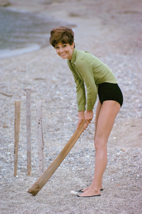 Audrey Hepburn plays cricket on the beach during a break from filming Stanley Donen's Two for the Road in 1966.