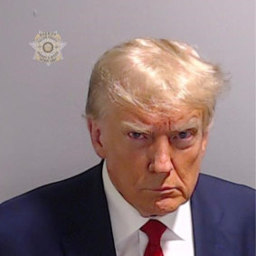 Donald Trump’s police mugshot is proudly displayed on his website.
