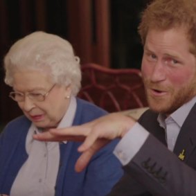 Harry hams it up with his grandmother in a video “battle” with Barack and Michelle Obama as a part of a video promotion for the Invictus Games.