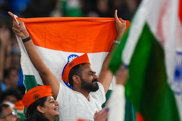 Indian fans cheer at the MCG on Friday night.