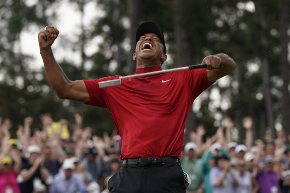 Woods celebrates his stirring triumph in 2019.