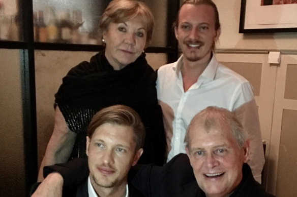 John Farnham with wife Jill and sons Rob (front) and James in 2018.