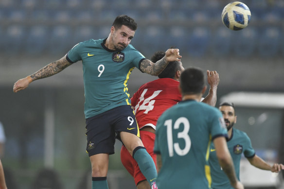 Australia’s Jamie Maclaren gets his head on the ball against Nepal in Kuwait earlier this year.