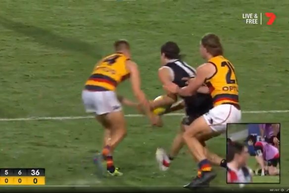 Adelaide’s David Mackay and St Kilda’s Hunter Clark simultaneously lunge for the ball. Clark ended up with a broken jaw.